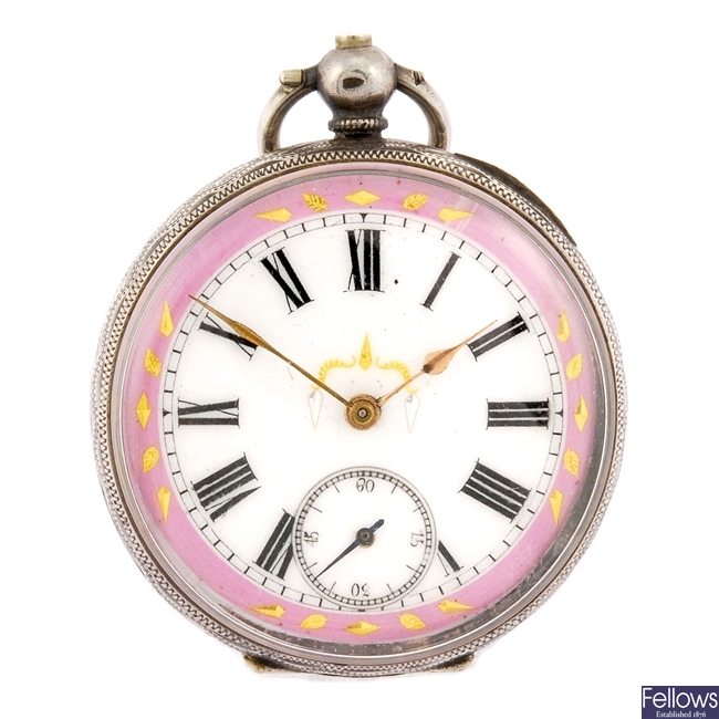 A continental white metal key wind open face pocket watch.