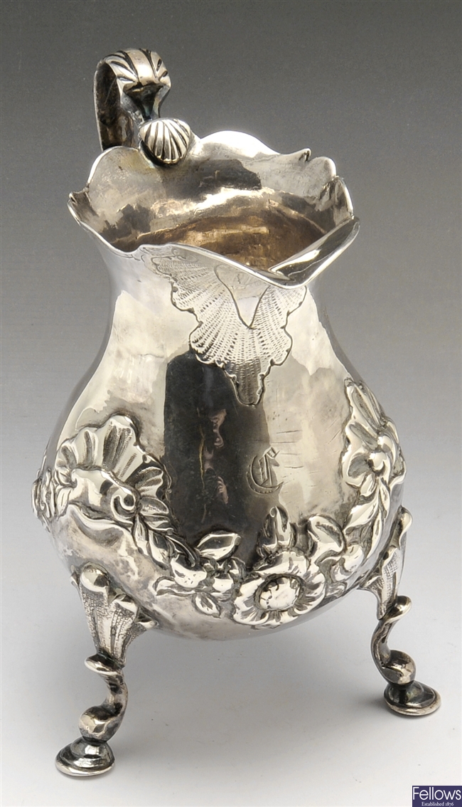 A George II silver cream jug.