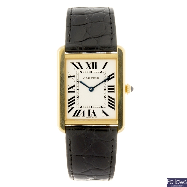 LOT 18 701015490 An 18k gold quartz Cartier Tank Solo wrist watch