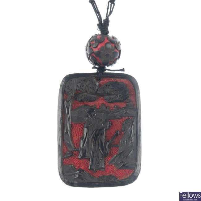 An early to mid 20th century Oriental cinnabar necklace.