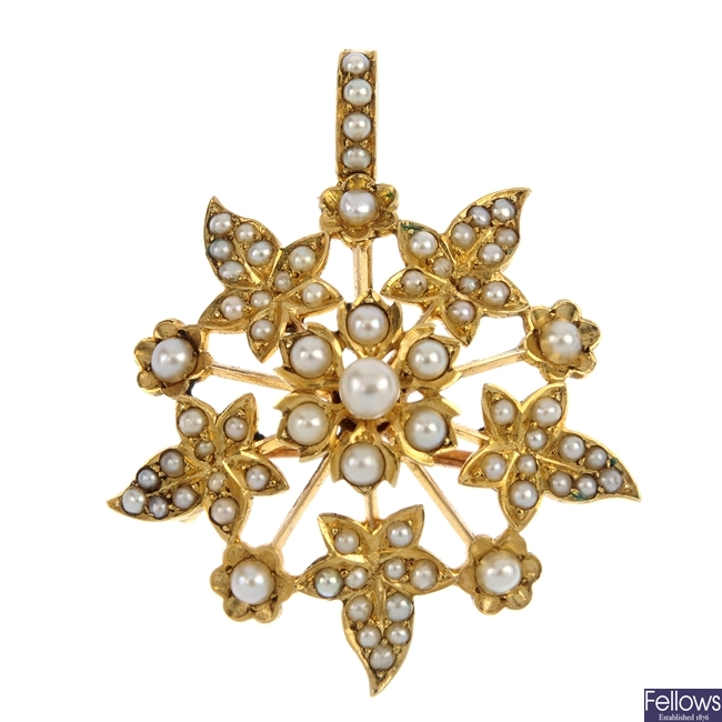An early 20th century gold seed and split pearl pendant.