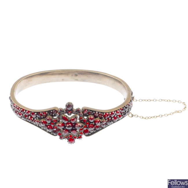 A late 19th century garnet and paste bangle.