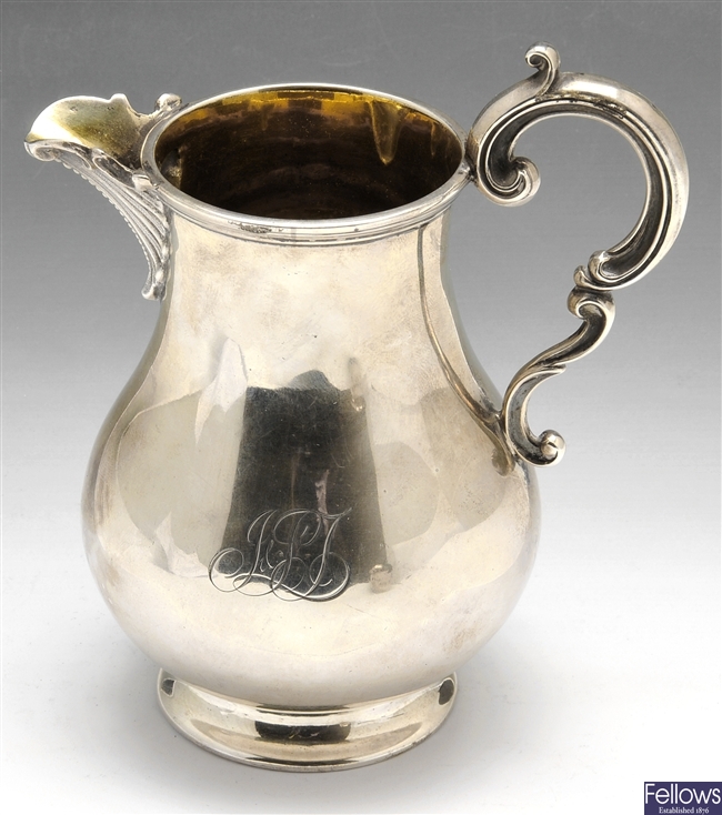A Victorian &  Edwardian silver cream jug.