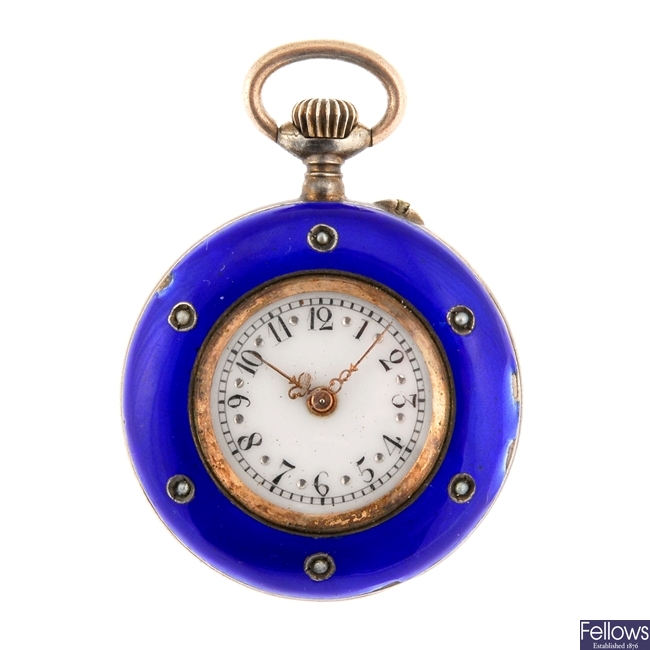 A blue enamel decorated keyless wind fob watch with bow.