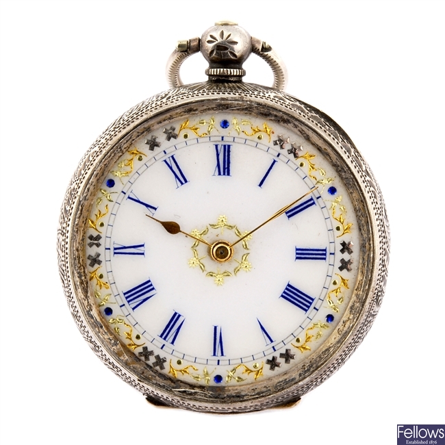 A continental white metal key wind pocket watch with a base metal trench style watch head.