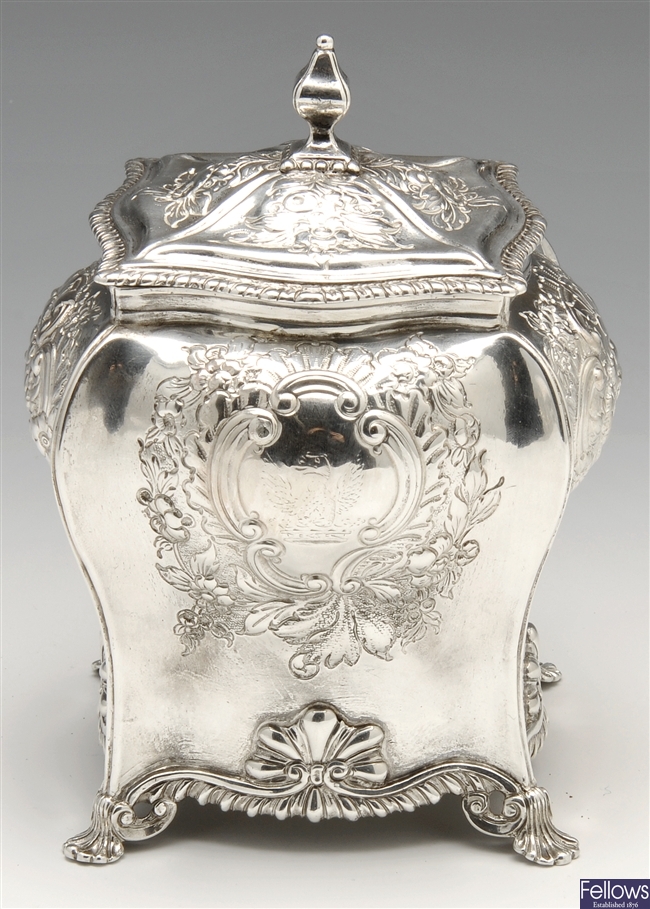 A George IV silver tea caddy.