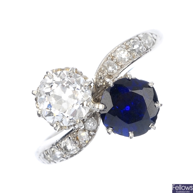 A mid 20th century sapphire and diamond two-stone crossover ring.