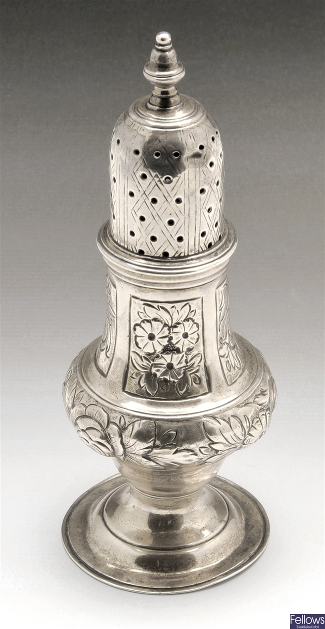 A George III silver caster.