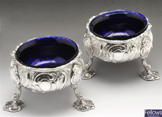 A George III pair of early silver open salts.