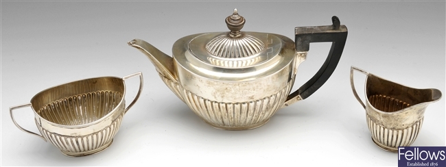 An Edwardian silver bachelor three piece silver tea service.