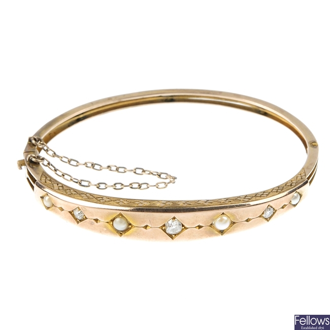 An early 20th century gold diamond and split pearl bangle.