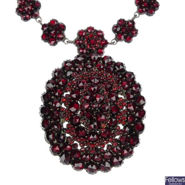 A late 19th century silver garnet and paste necklace.