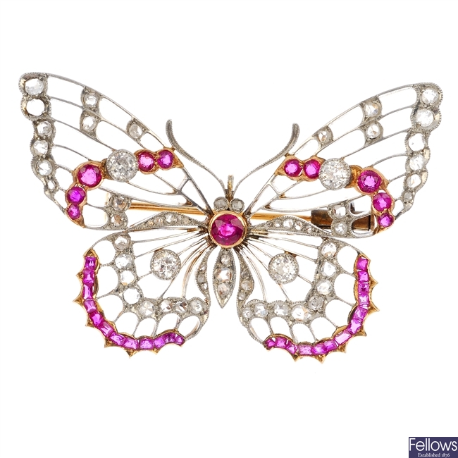 An early 20th century platinum and 18ct gold ruby and diamond butterfly brooch.