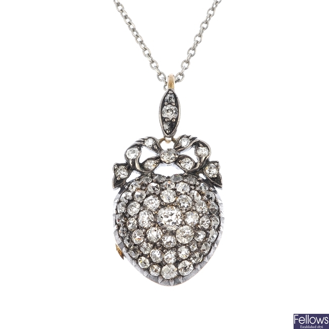 A late Victorian silver and gold diamond heart locket.