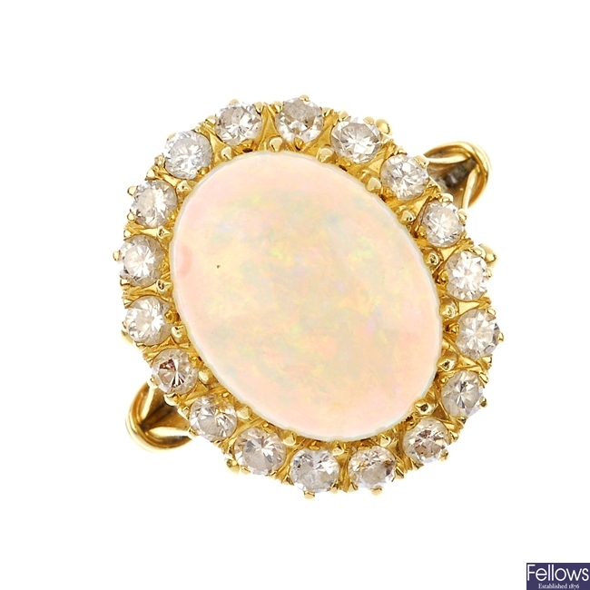 A mid 20th century 18ct gold opal and diamond cluster ring.