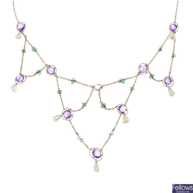 An early 20th century 15ct gold amethyst, emerald and baroque pearl garland necklace.