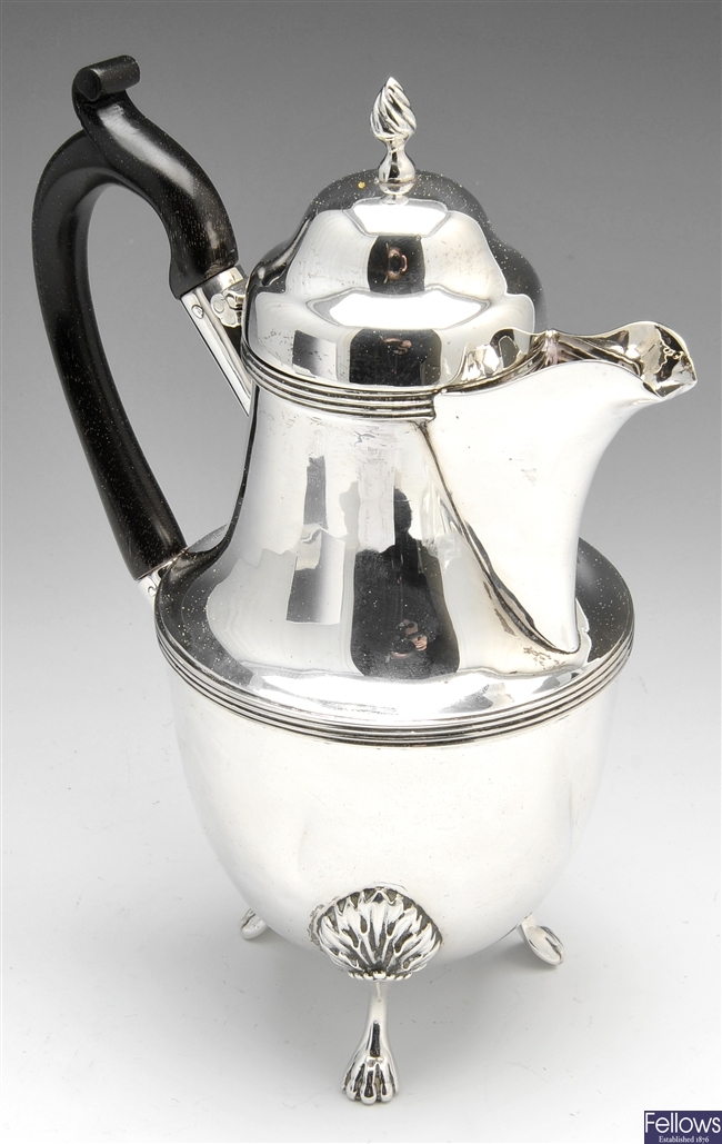 A Victorian silver hot water pot & early 20th century pepper.