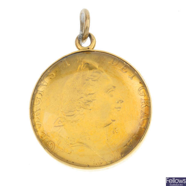 A George III half-guinea pendant.