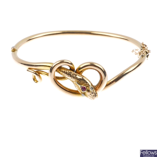 A late 19th century 9ct gold hinged snake bangle.