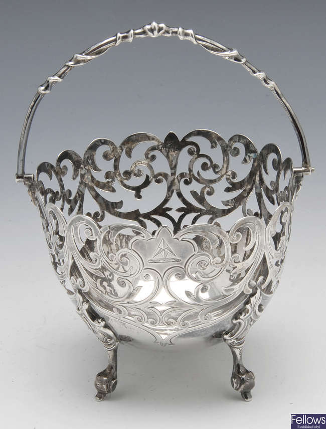 A Victorian silver openwork sugar basket.