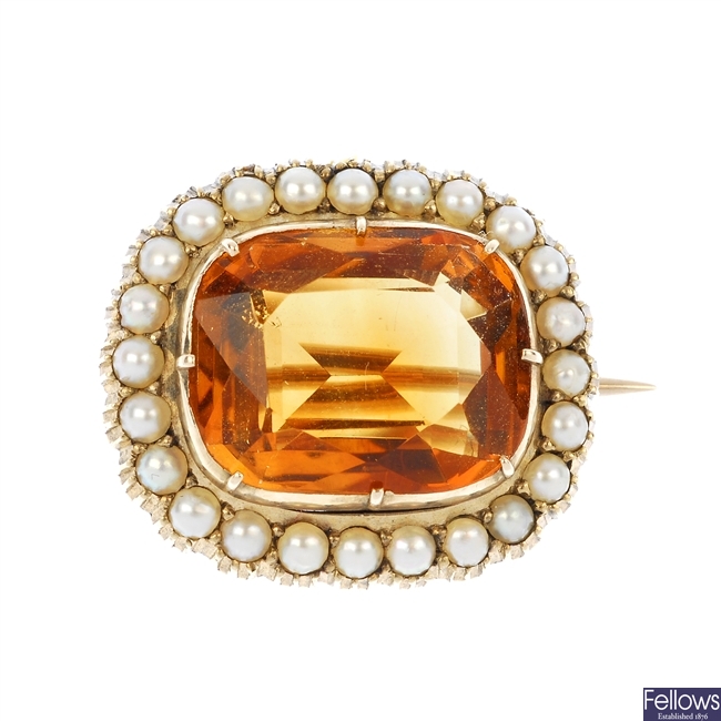 An early 20th century citrine and split pearl cluster brooch.
