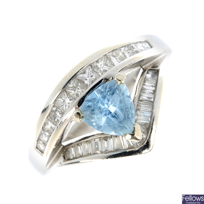 A blue gem and diamond dress ring.