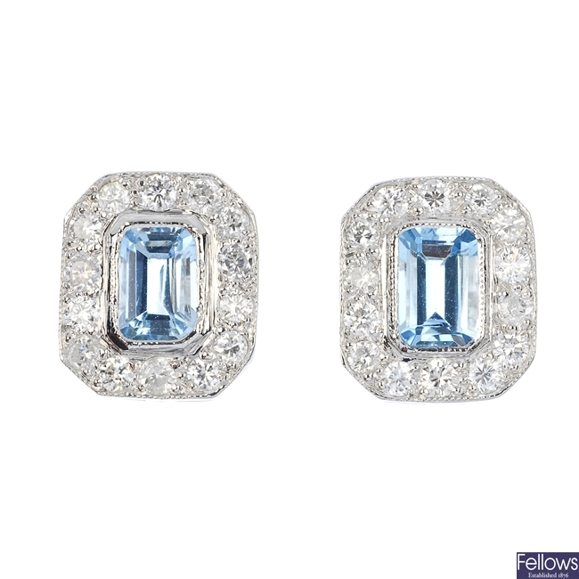 A pair of aquamarine and diamond cluster earrings.