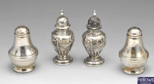 A selection of Edwardian and later silver pepperettes.