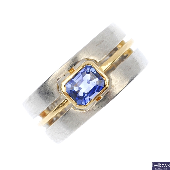 A sapphire single-stone band ring.