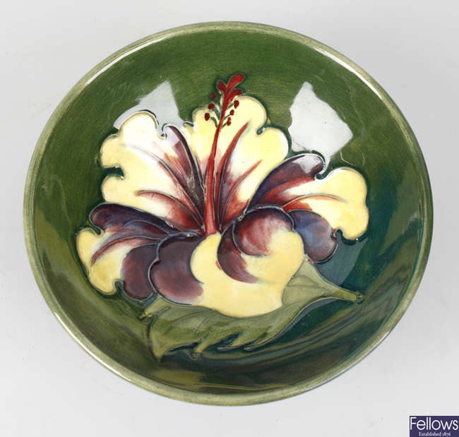 A small mid 20th century Walter Moorcroft pottery 'Hibiscus' pattern bowl.