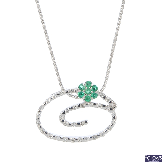 A 14ct gold emerald and diamond pendant.