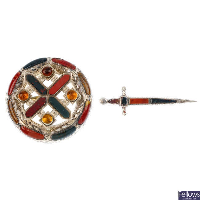 A late 19th century Scottish hardstone brooch and a sword brooch. 