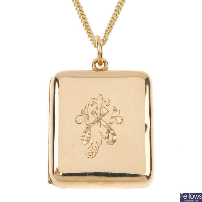 An early 20th century 15ct gold locket and later 9ct gold chain.