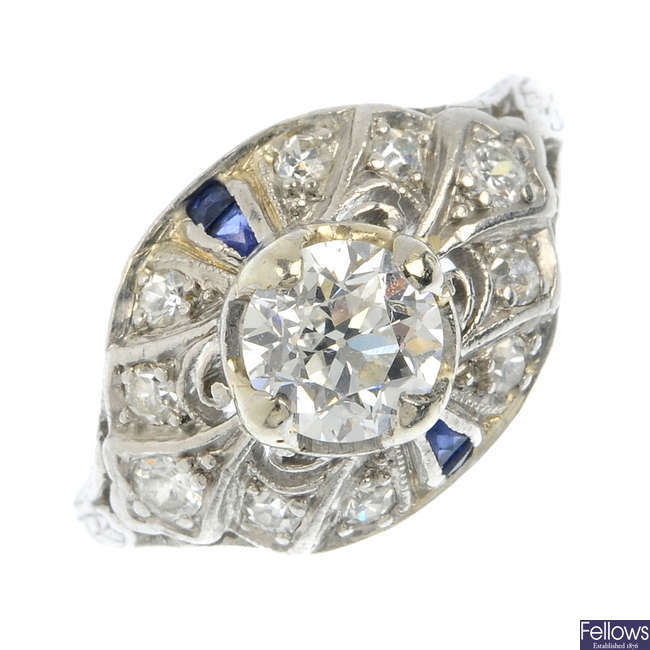 An early 20th century platinum diamond and sapphire dress ring.