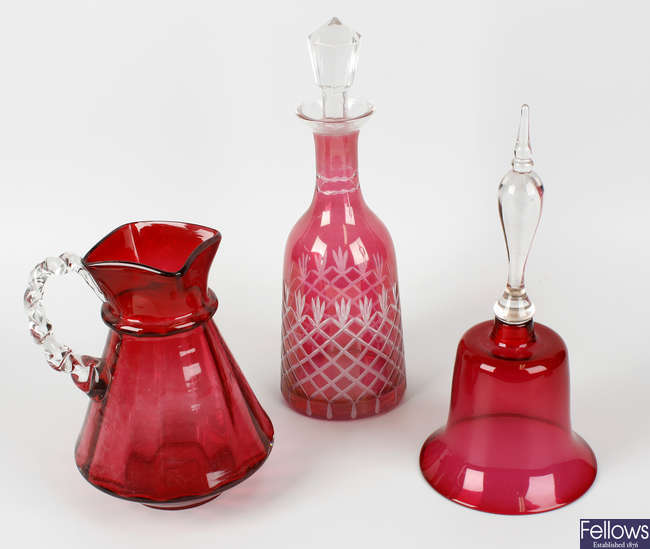 A collection of assorted cranberry glass