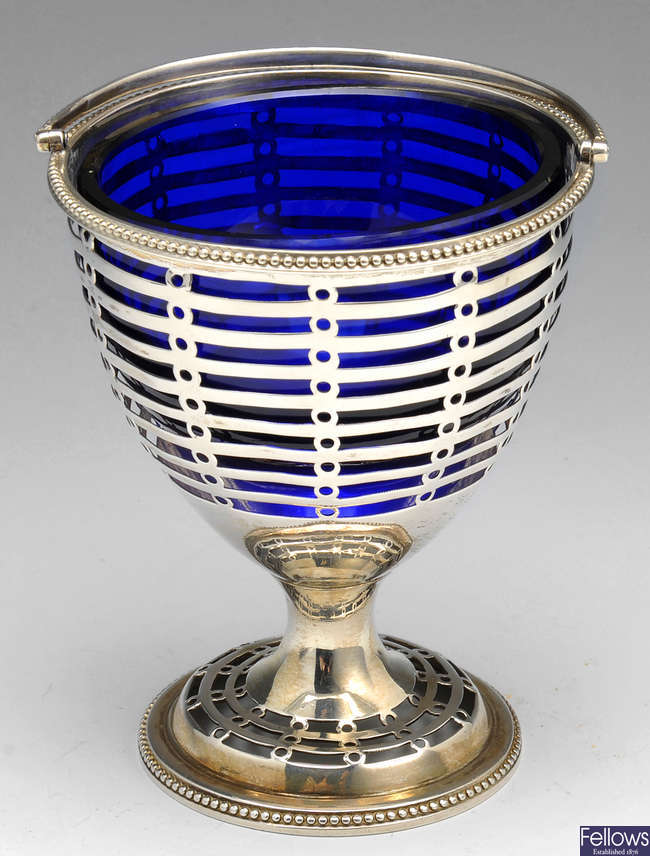 A George III silver swing handle sugar basket.