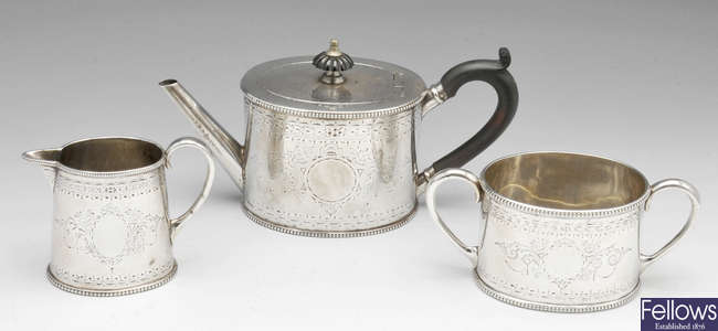 A Victorian silver three piece bachelor tea service.