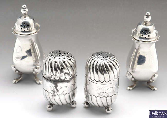 A pair of Victorian salt and pepper pots & two later pepper pots.