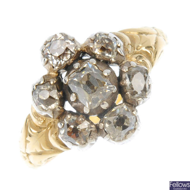 A late 19th century silver and gold diamond cluster ring.