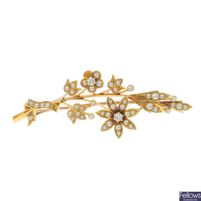 An early 20th century gold diamond and split pearl spray brooch.