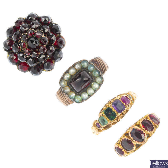 A selection of two early 19th century and two early 20th century gold gem-set rings. 