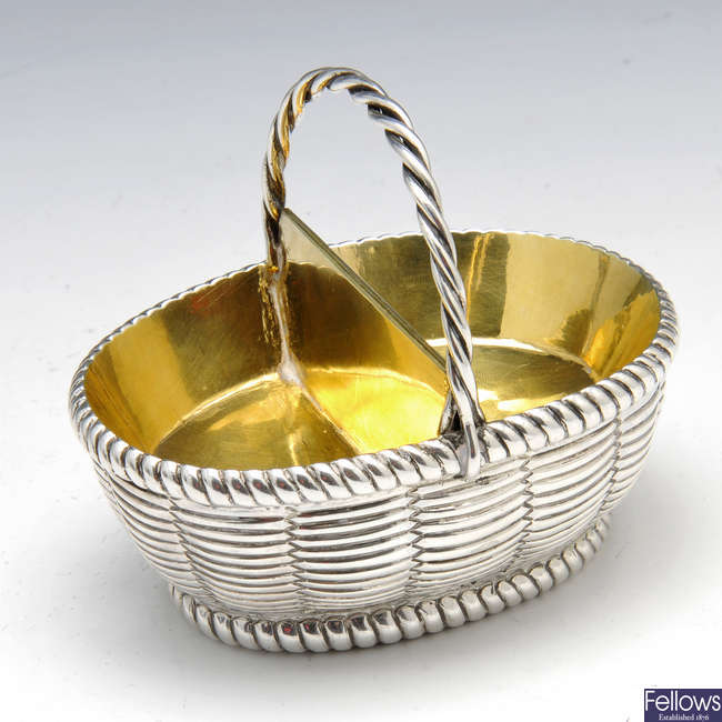 A George III silver open salt modelled as a basket.