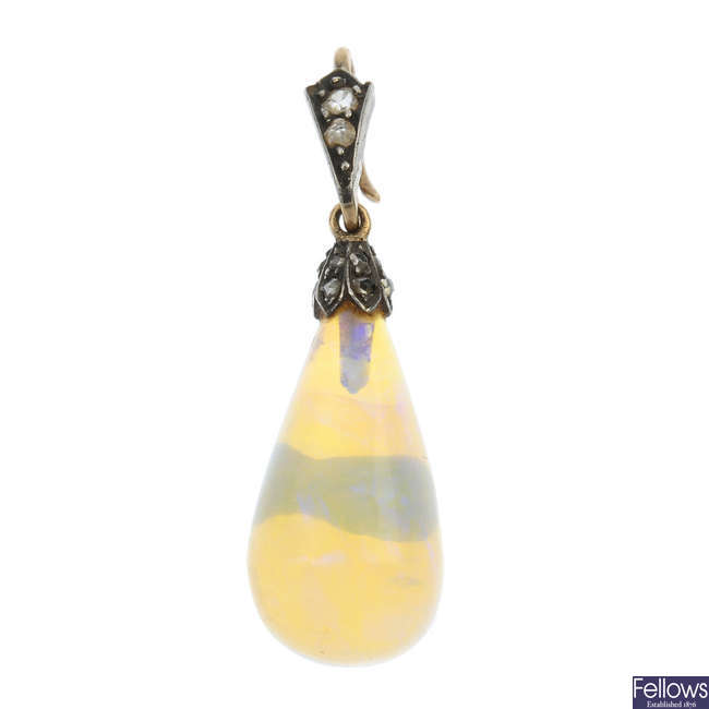 An early 20th century gold opal and diamond pendant. 