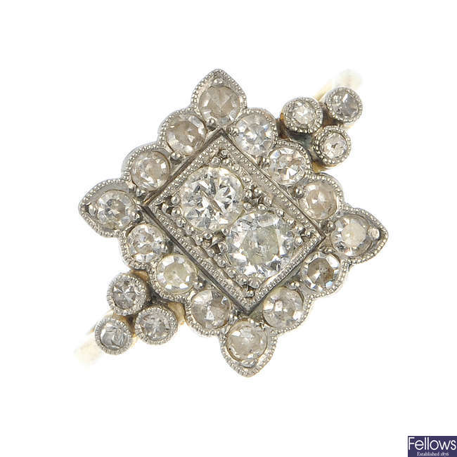 A mid 20th century platinum and 18ct gold diamond dress ring.
