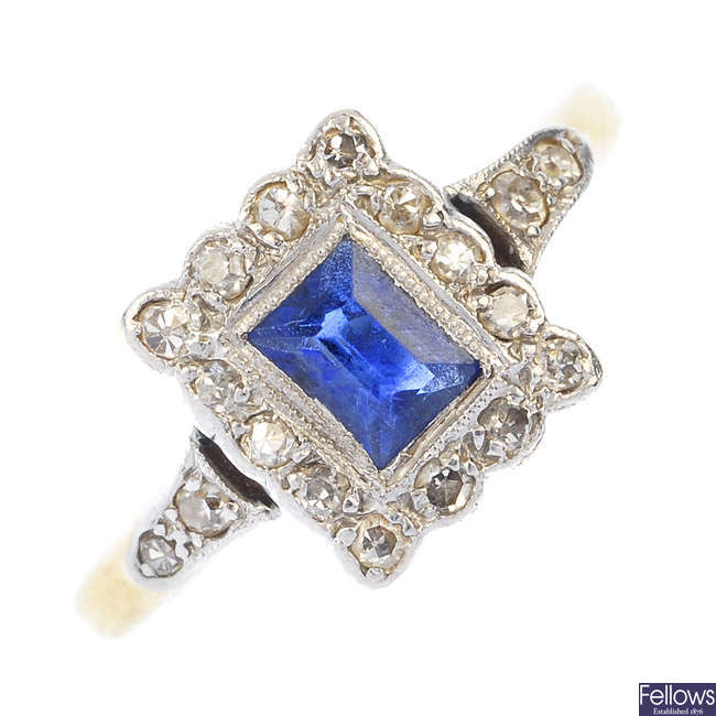 A mid 20th century platinum and 18ct gold sapphire and diamond cluster ring. 