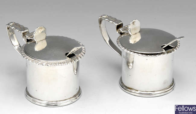 A pair of late Victorian silver mustard pots.