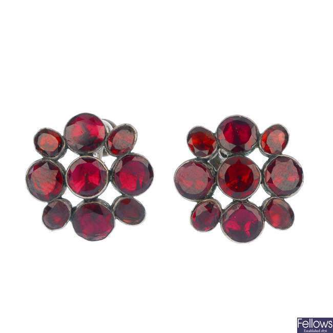 A late 19th century garnet ring and earrings set