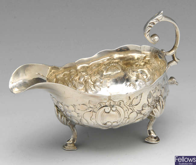 A George III silver sauce boat.