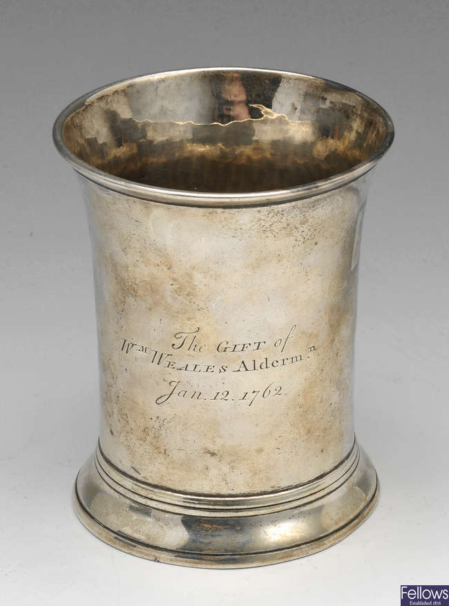 A George III silver beaker.
