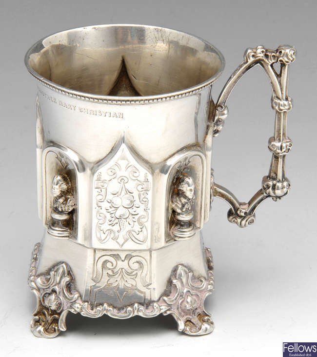A Victorian silver mug of gothic style.